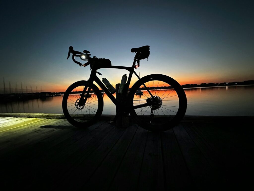 a bike is parked on a wooden dock