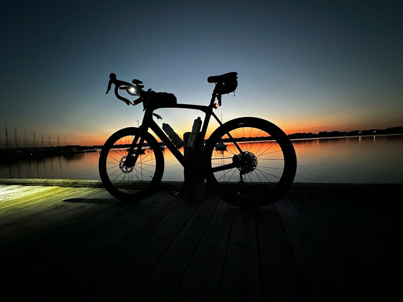 a bike is parked on a wooden dock