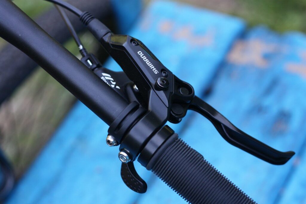 a close up of a bike handlebar on a bench